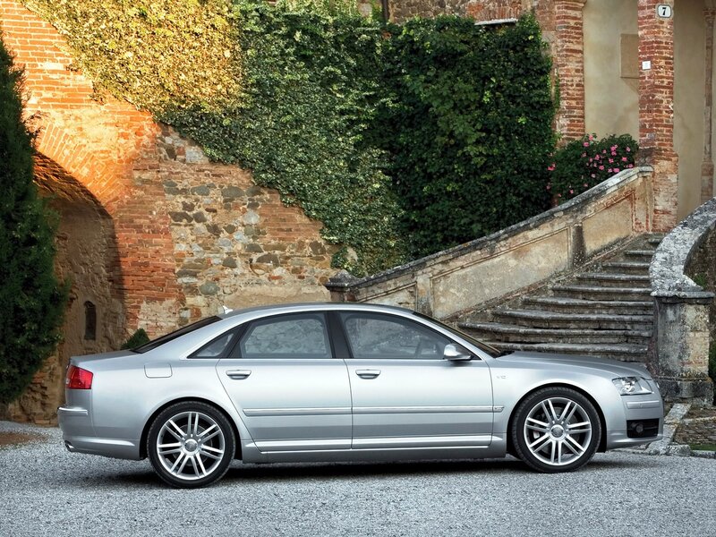 Silver Audi A8 parked by stairs