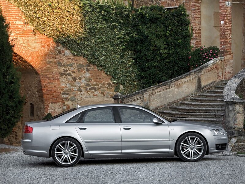silver audi a8 parked by stone stairs