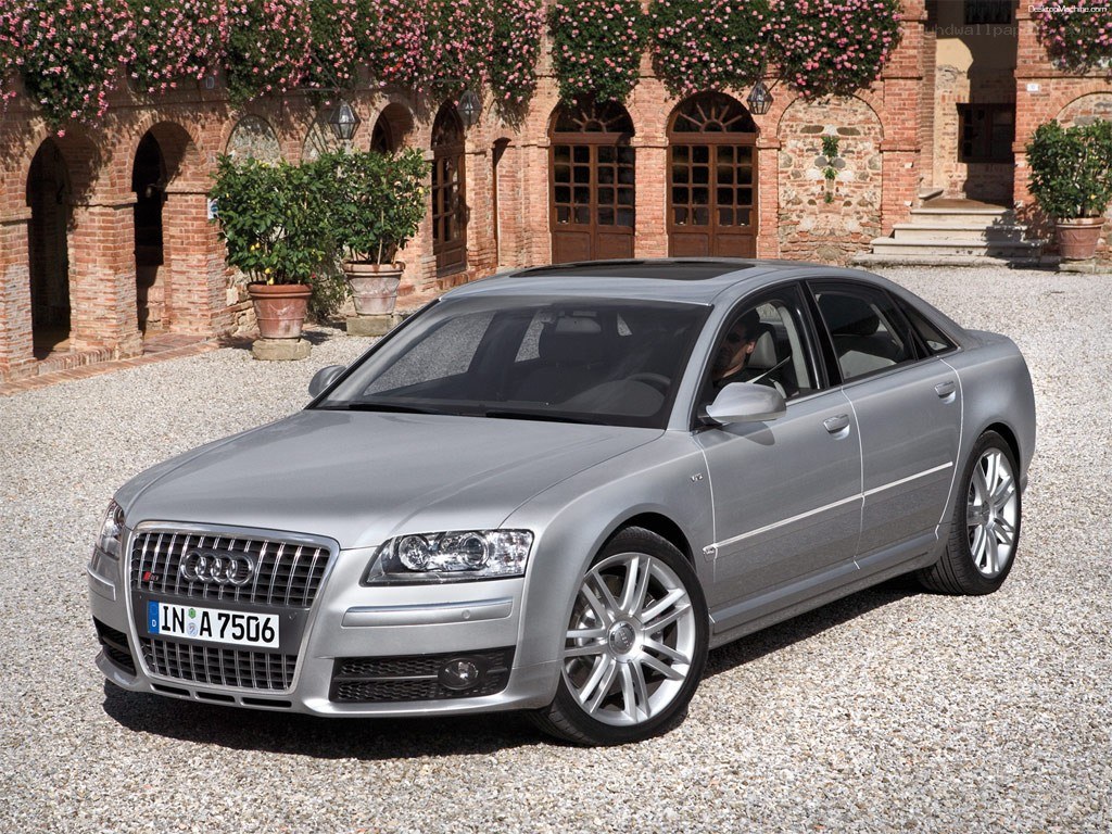 silver audi a8 parked in courtyard