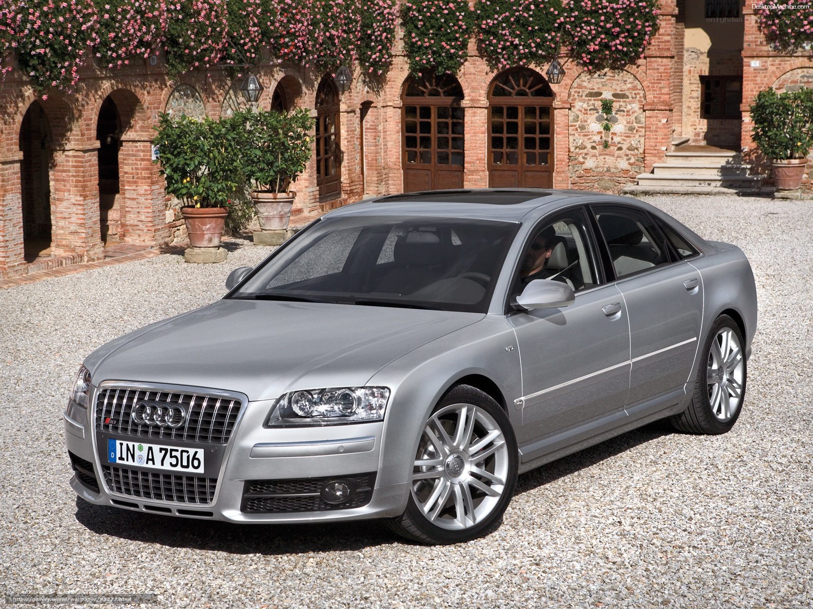 silver audi a8 parked in courtyard