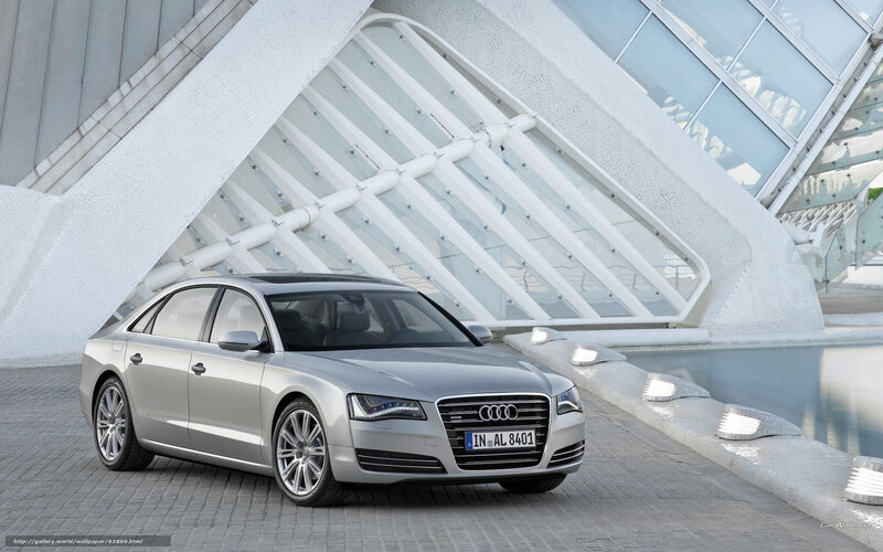 Silver Audi A8 parked in modern architecture
