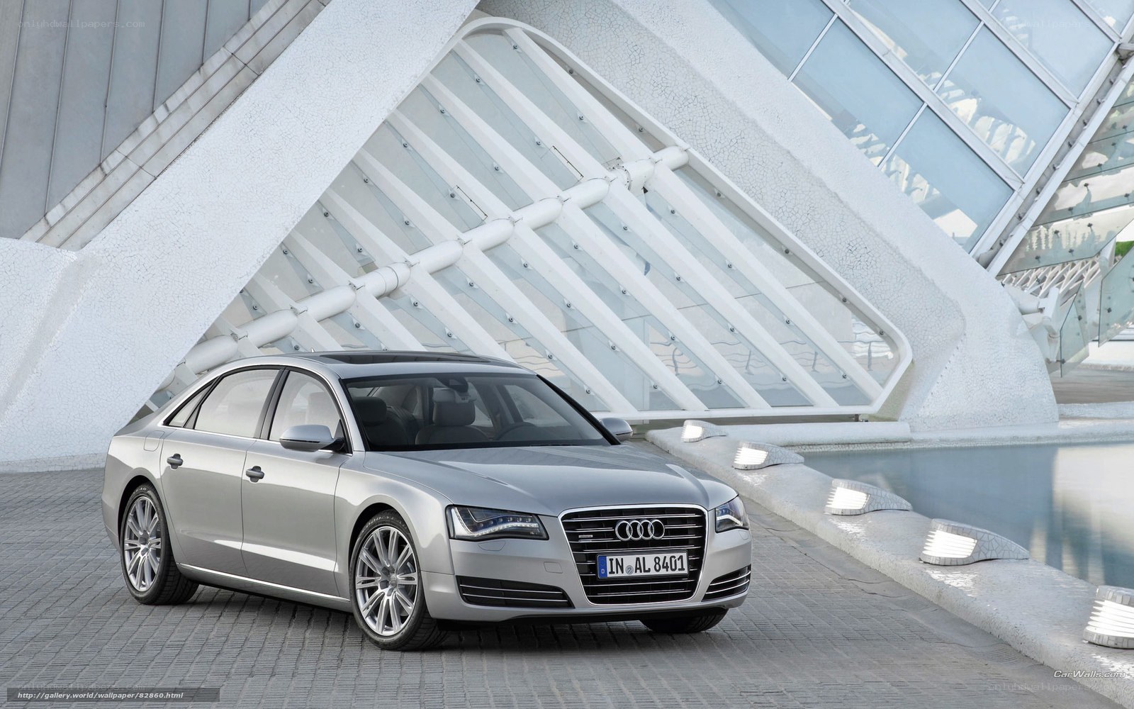 Silver Audi A8 parked in modern architecture