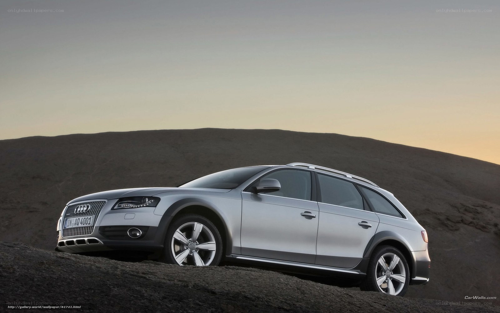 silver audi allroad on hill