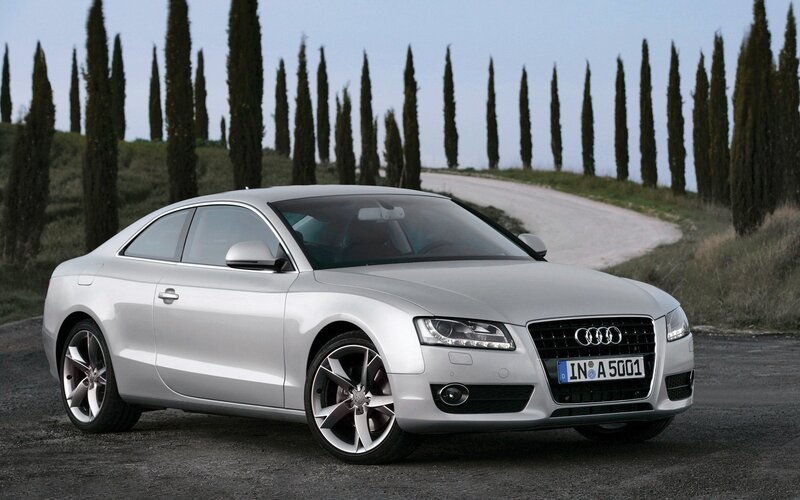Silver Audi Coupé on a country road