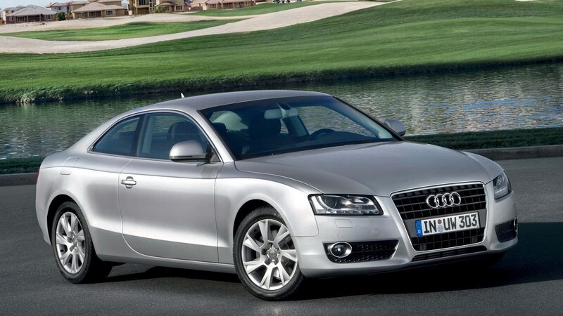 Silver Audi Coupé on a golf course