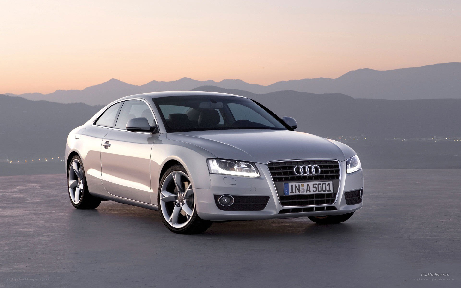 silver audi coupe at dusk