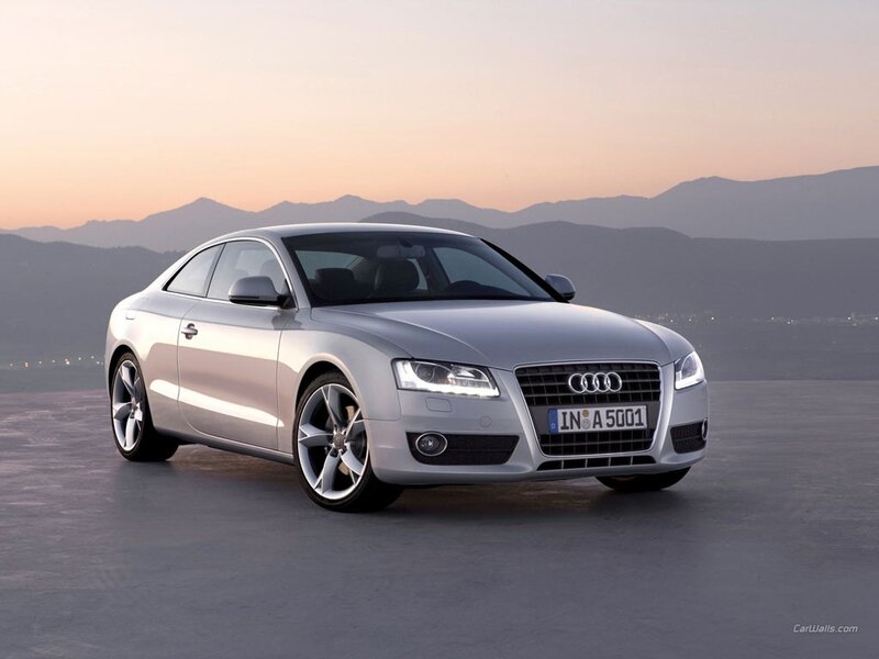 silver audi coupe at sunset