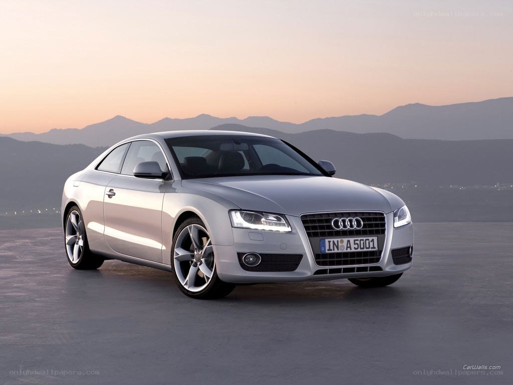 silver audi coupe at sunset