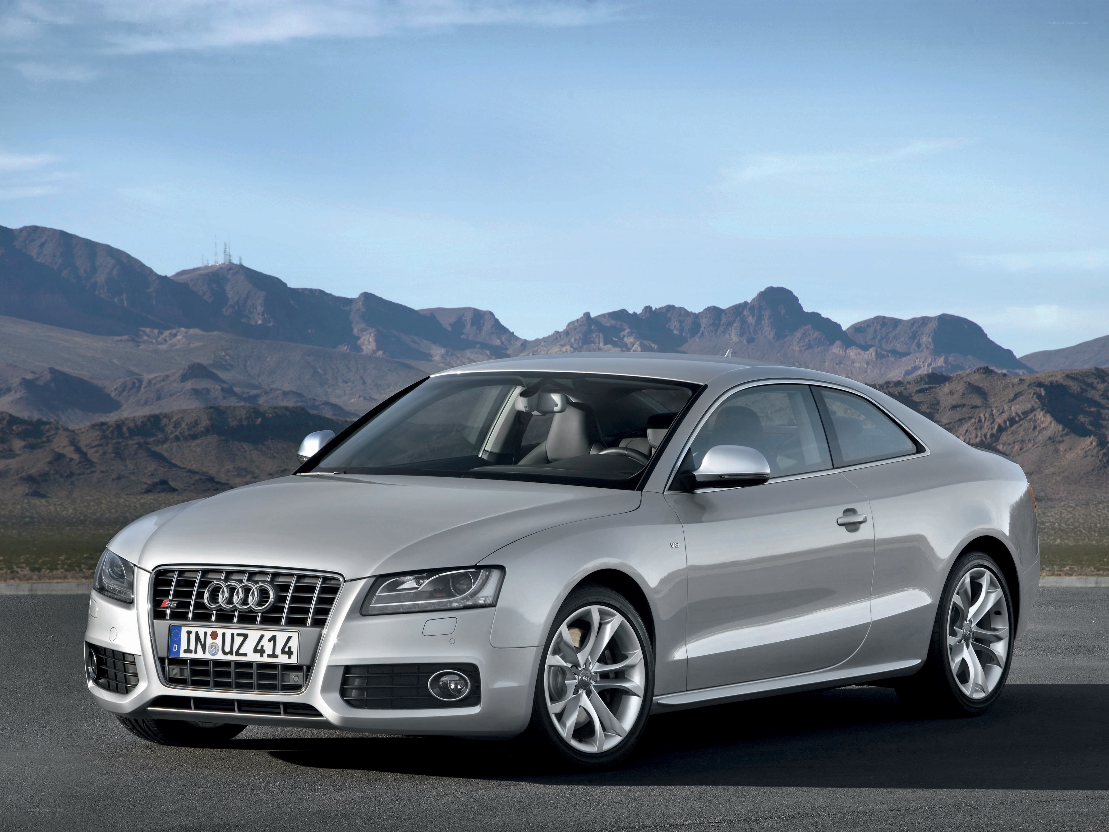 silver audi coupe on desert road