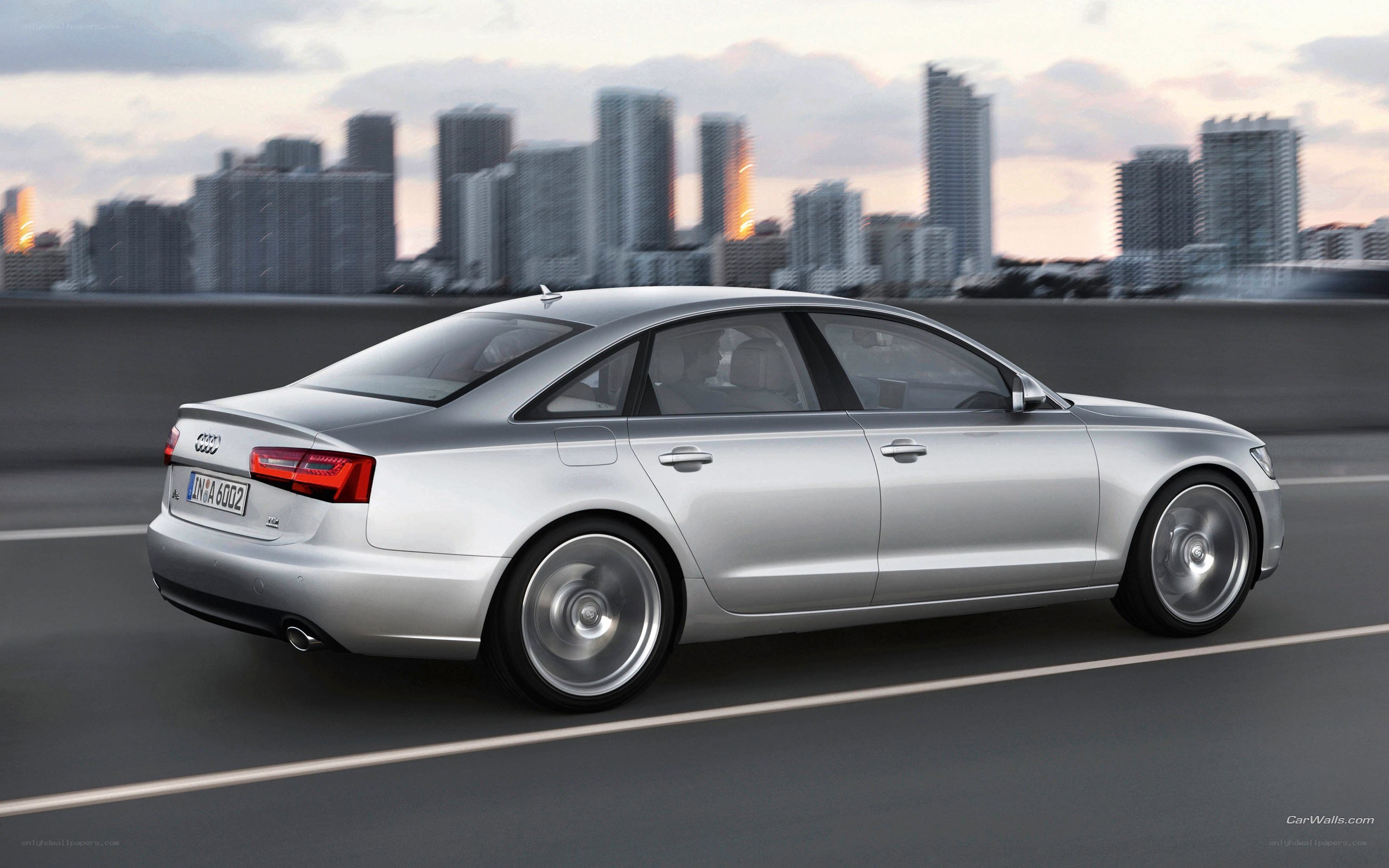 silver audi driving in city