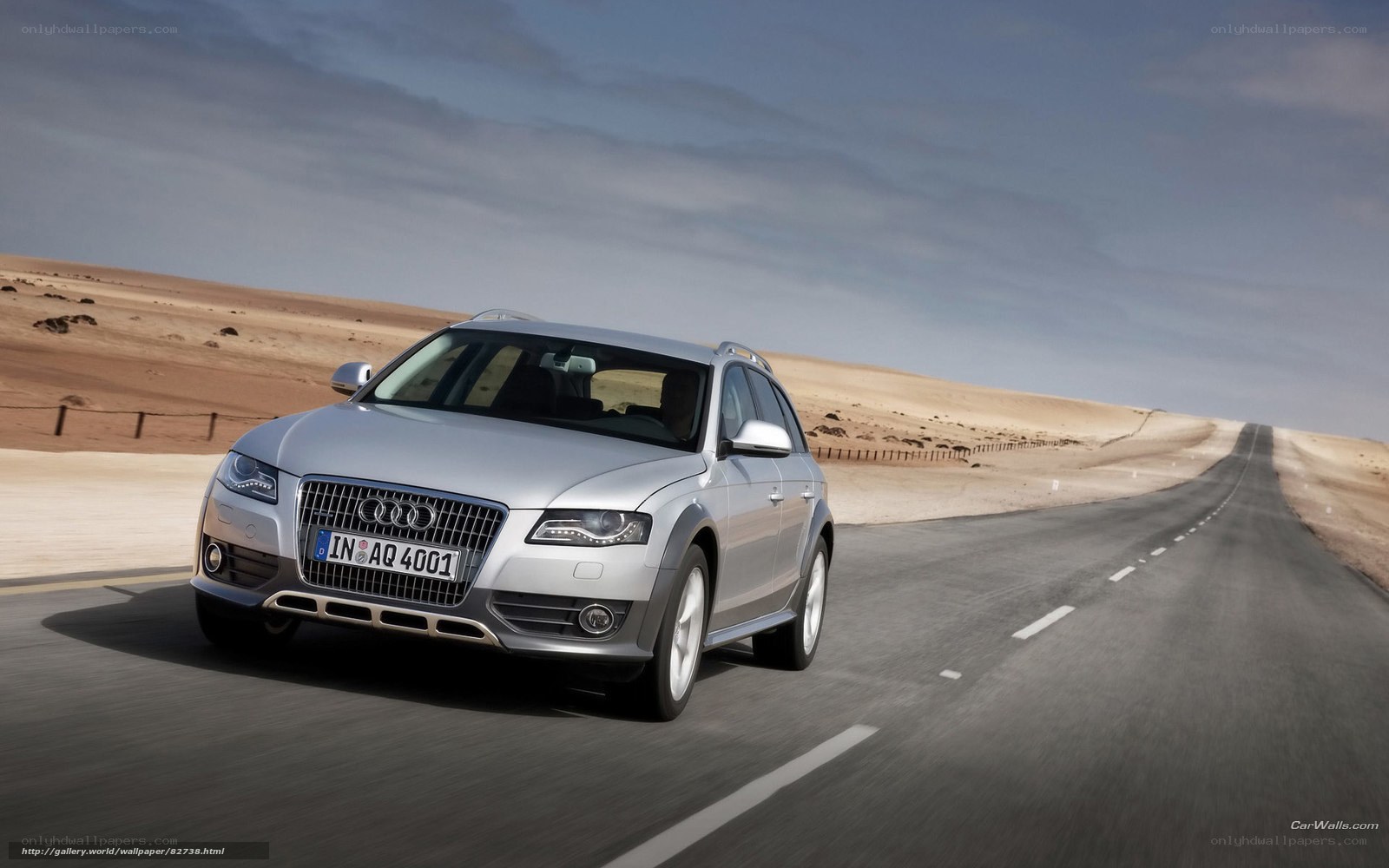 silver audi driving on desert road