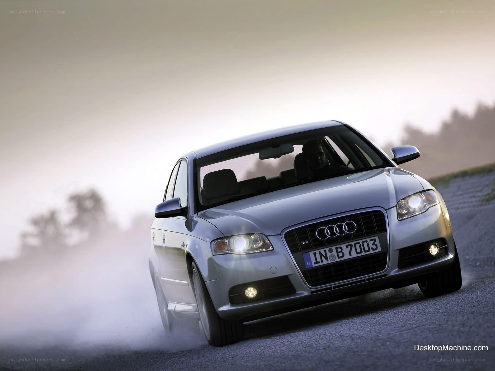 silver audi driving on road