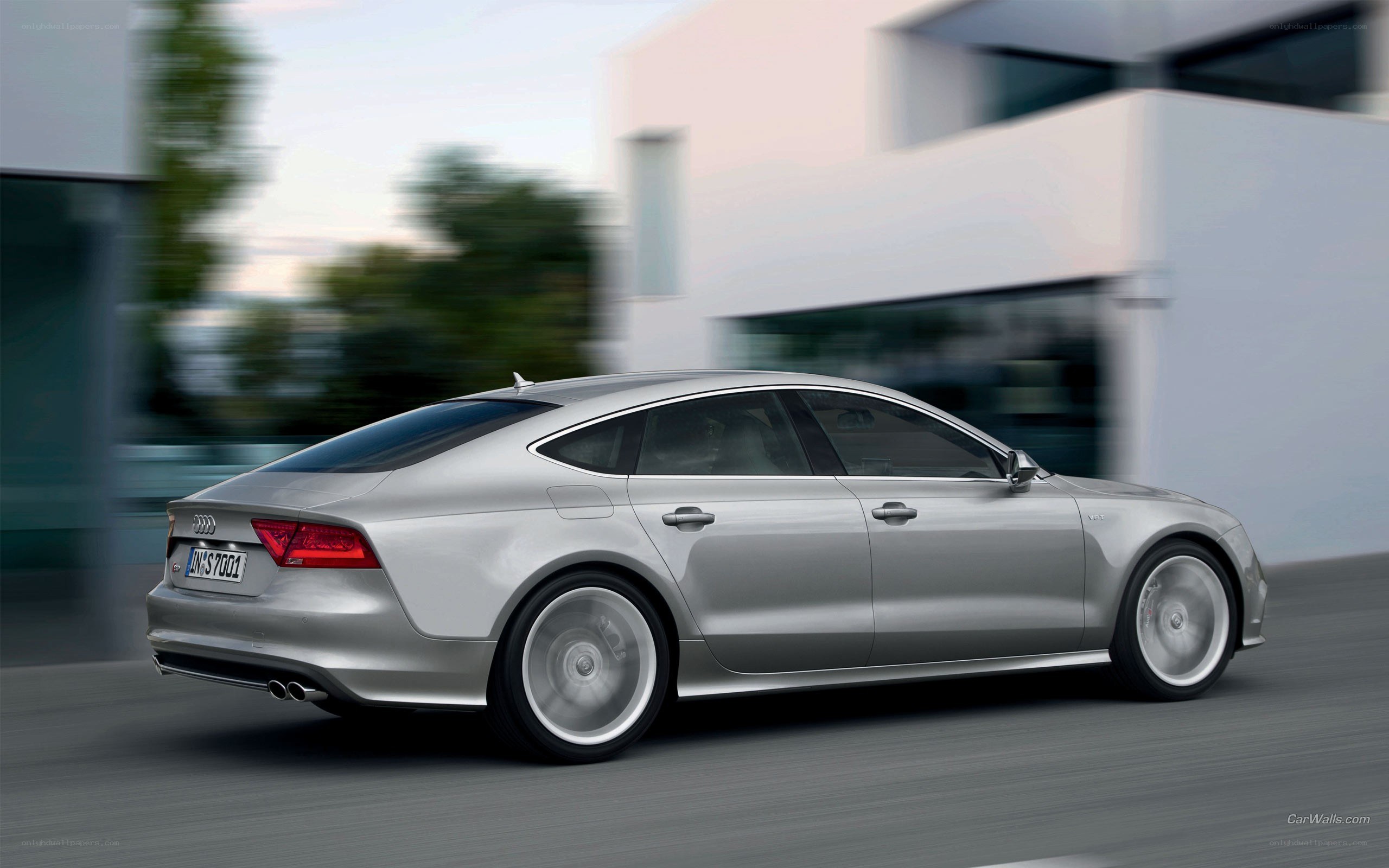 silver audi driving on road