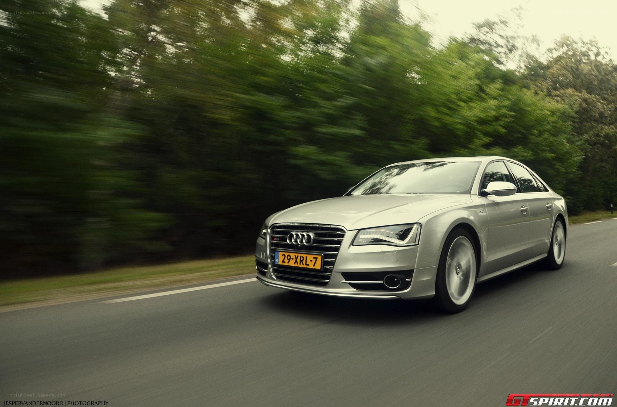 silver audi driving on road