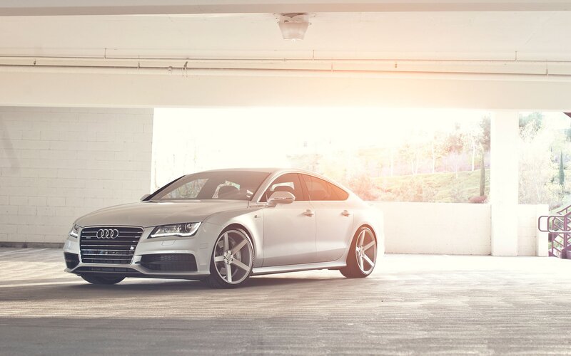 silver audi in parking garage