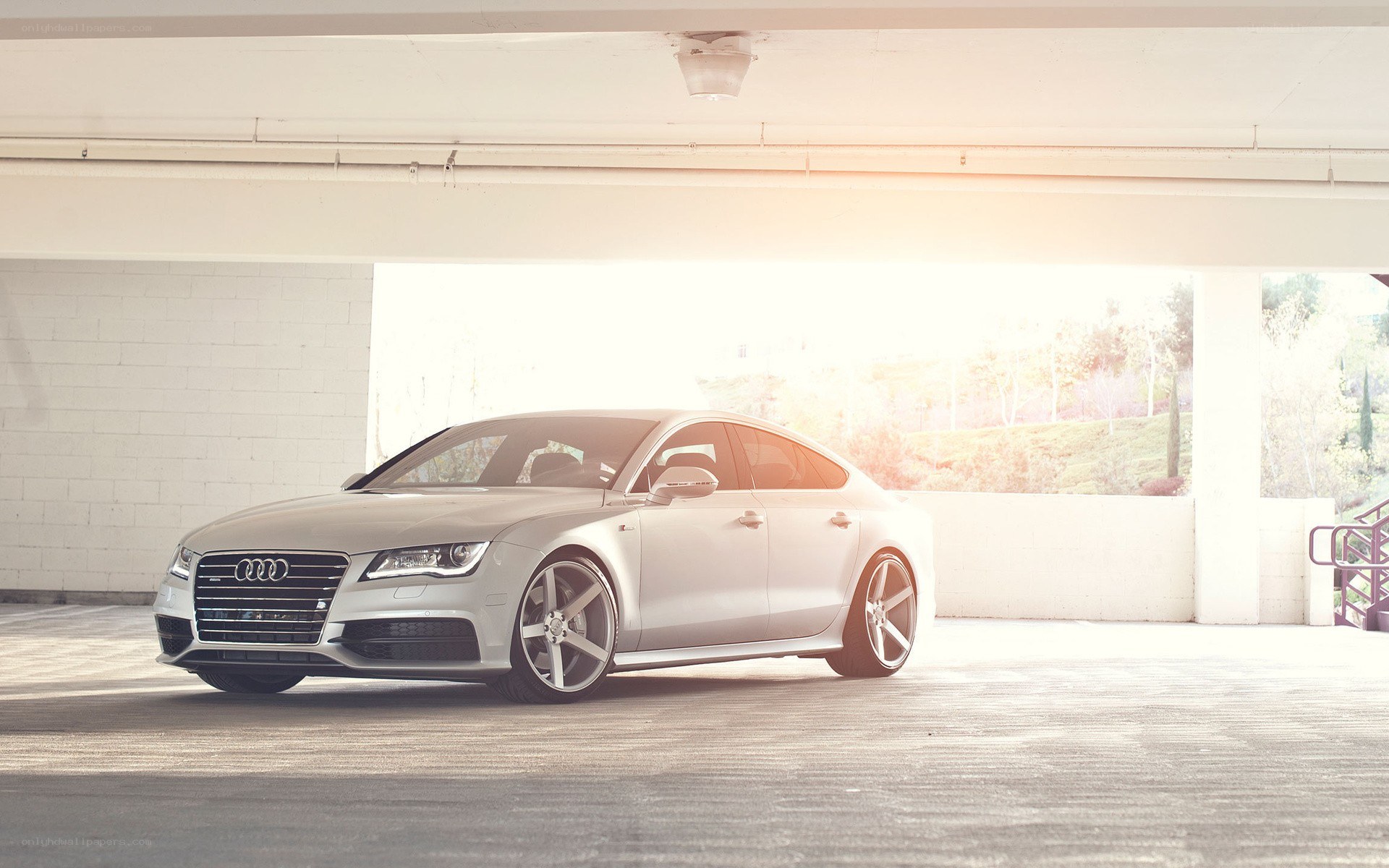 silver audi in parking garage