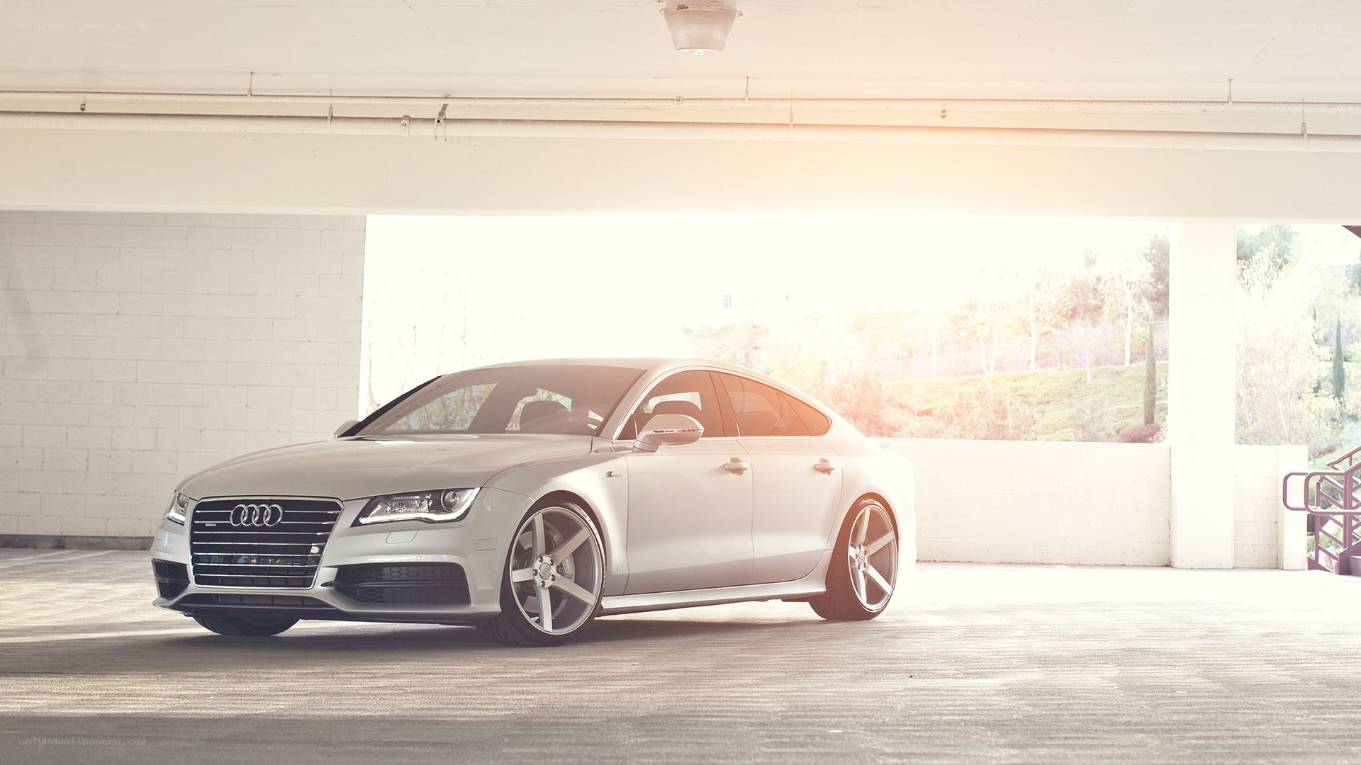 silver audi in parking garage