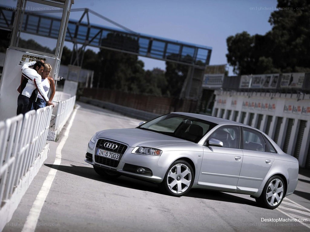 Silver Audi on a racetrack