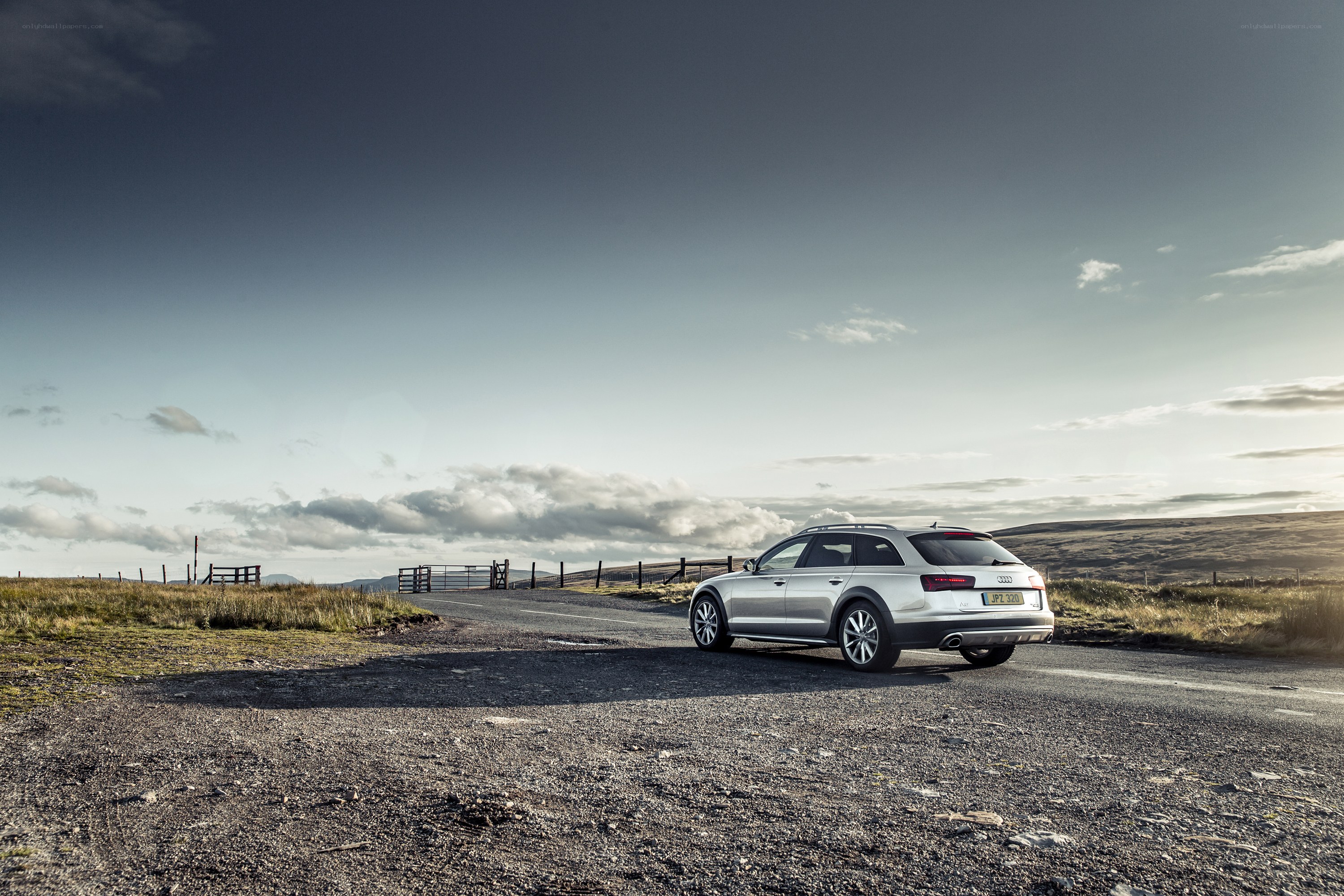 Silver Audi on a rural road
