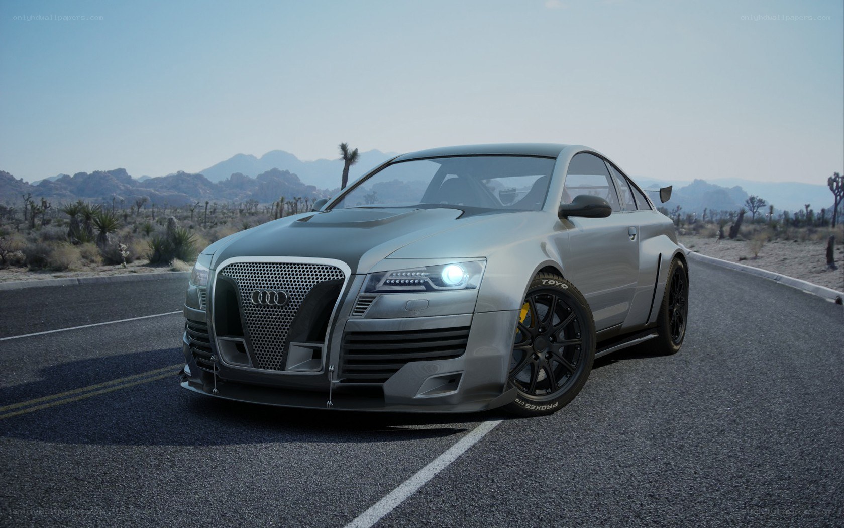 silver audi on desert road