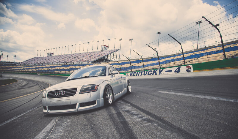 silver audi on racetrack
