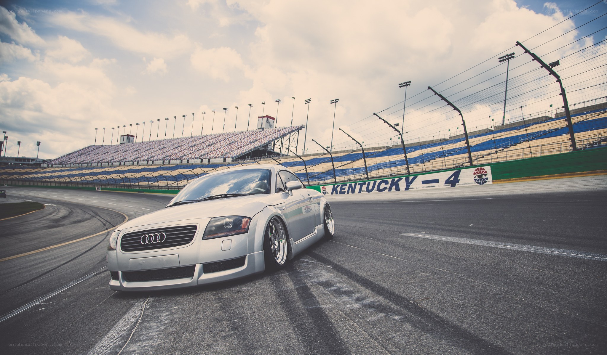 silver audi on racetrack