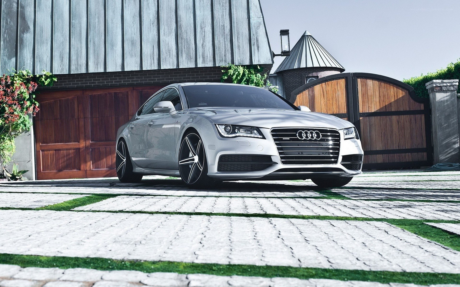 Silver Audi parked in driveway