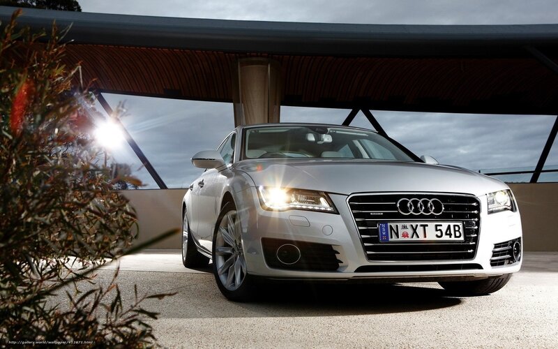 Silver Audi parked under a canopy