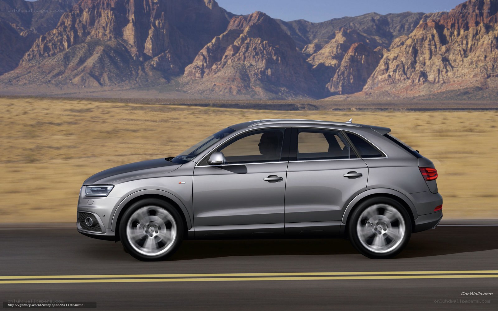 silver audi q3 driving on road