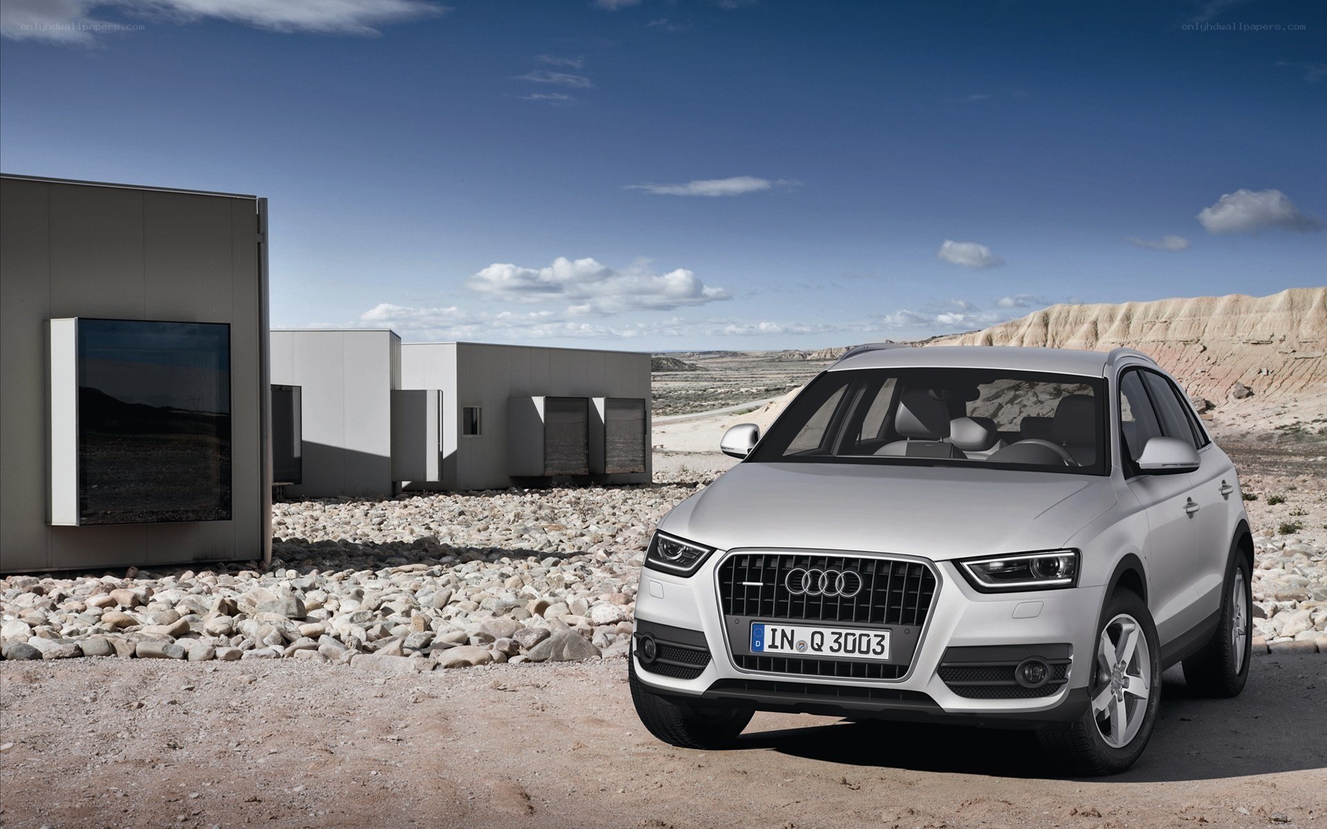 Silver Audi Q3 in desert landscape