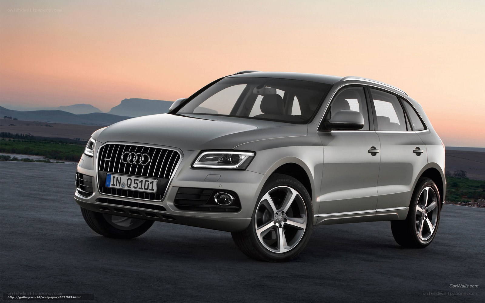 Silver Audi Q5 at sunset