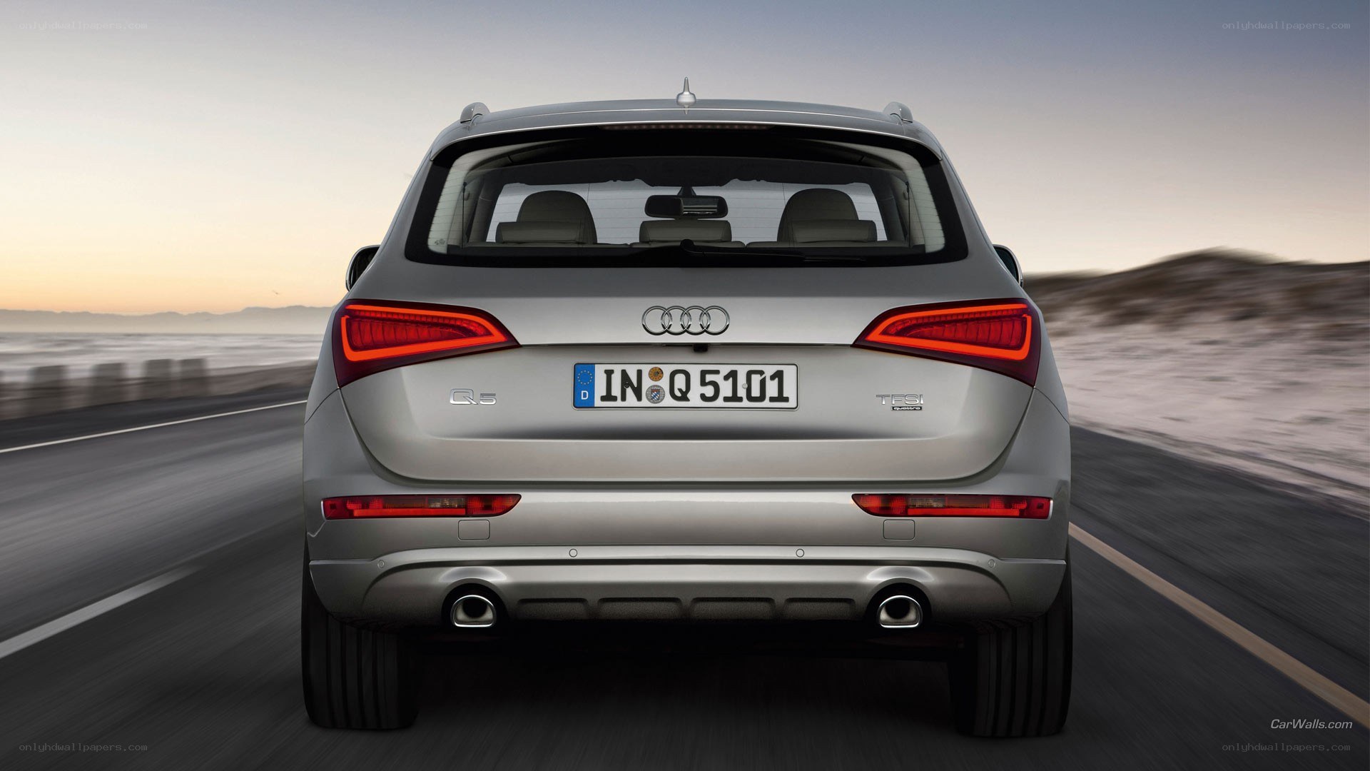silver audi q5 driving on road