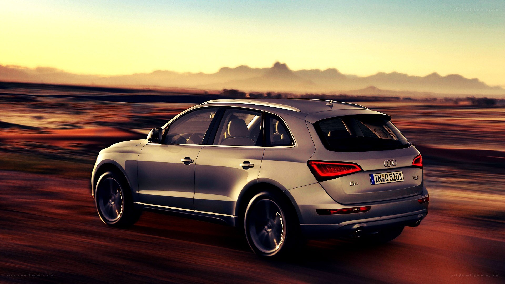 silver audi q5 in motion