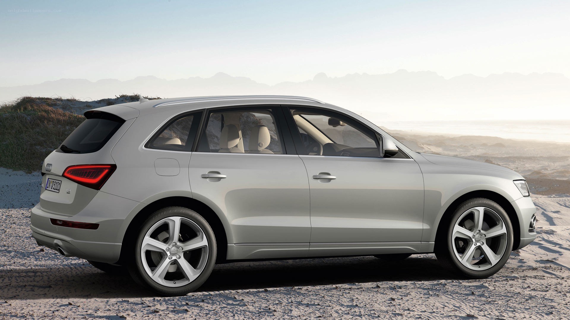 silver audi q5 on beach