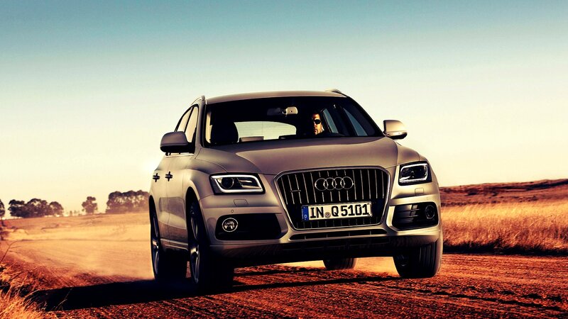Silver Audi Q5 on Dirt Road — Dramatic