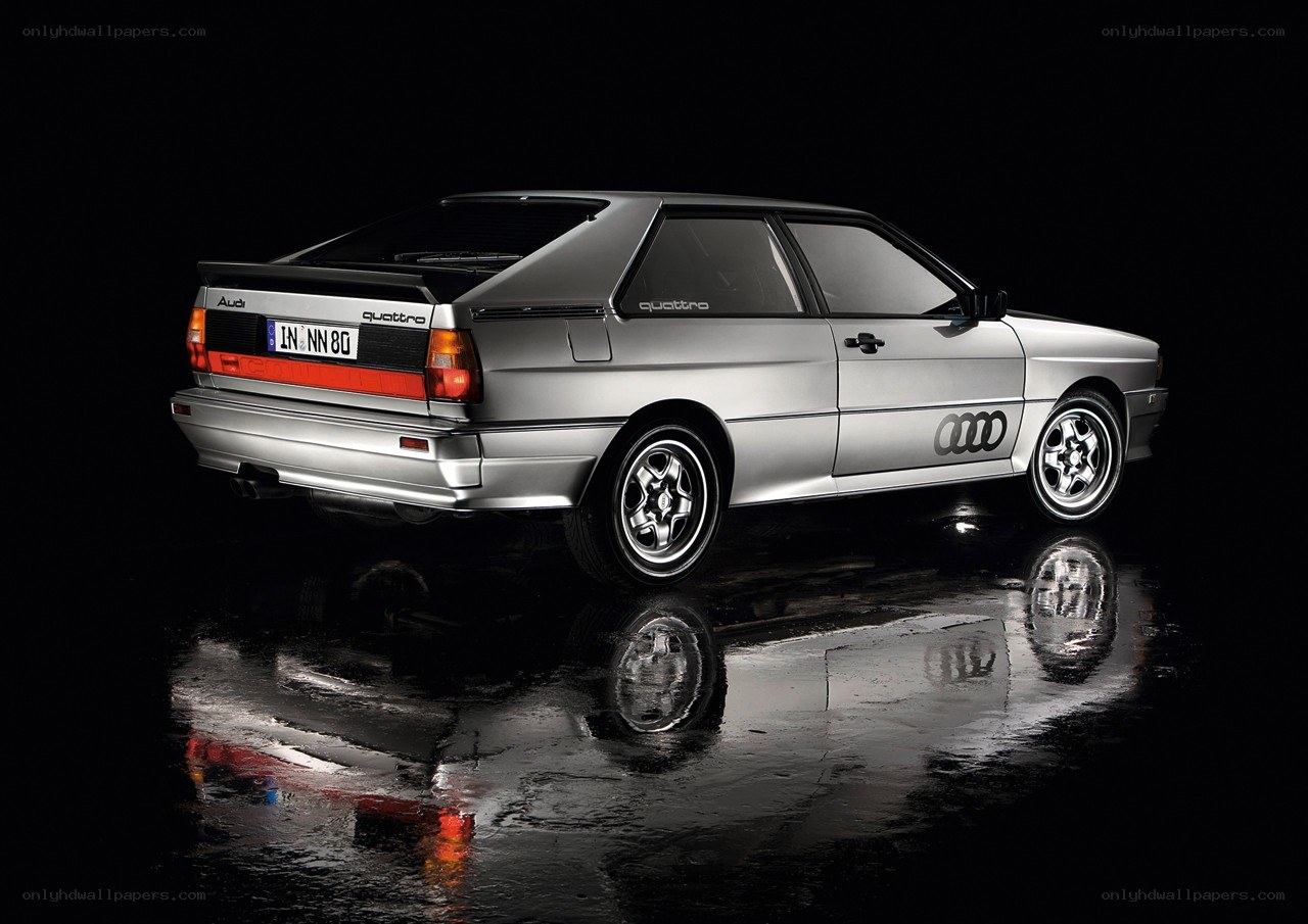 Silver Audi Quattro on wet surface