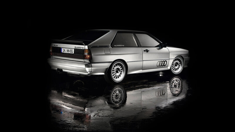 Silver Audi Quattro on wet surface