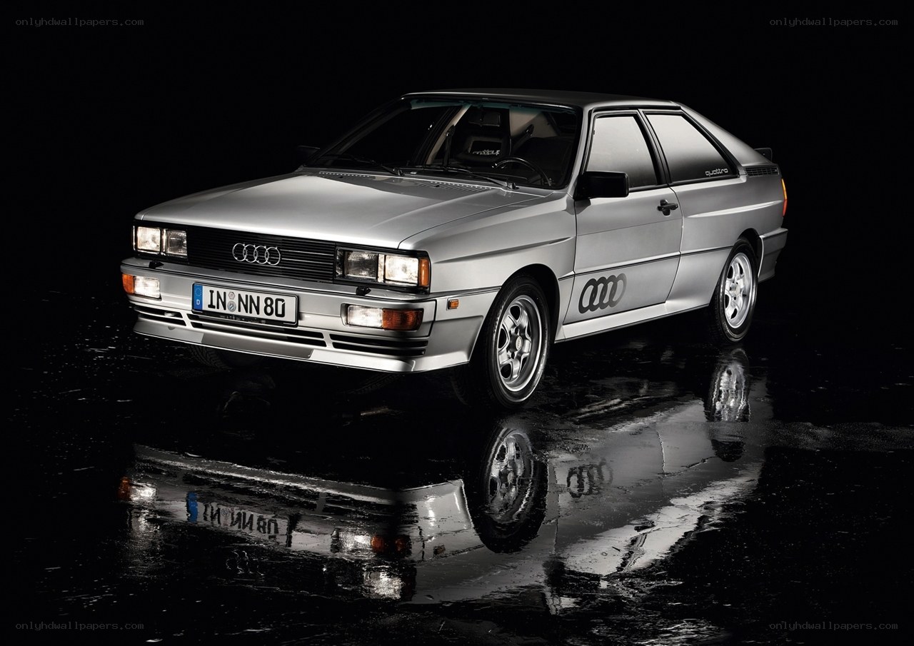 Silver Audi Quattro on wet surface