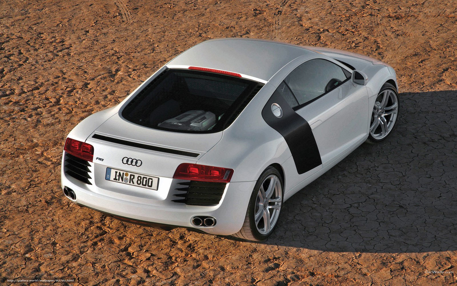Silver Audi R8 on cracked earth