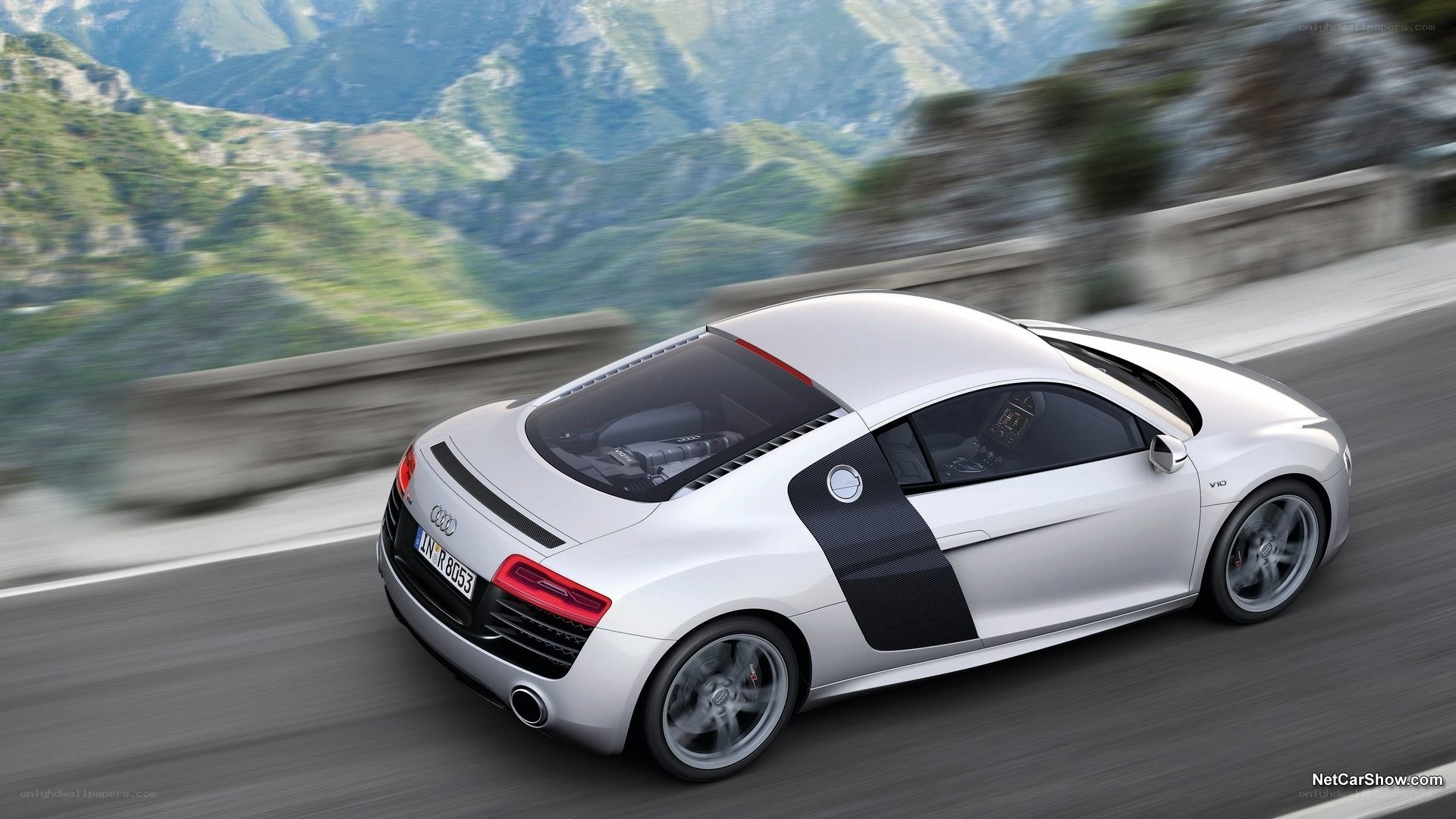 silver audi r8 on mountain road