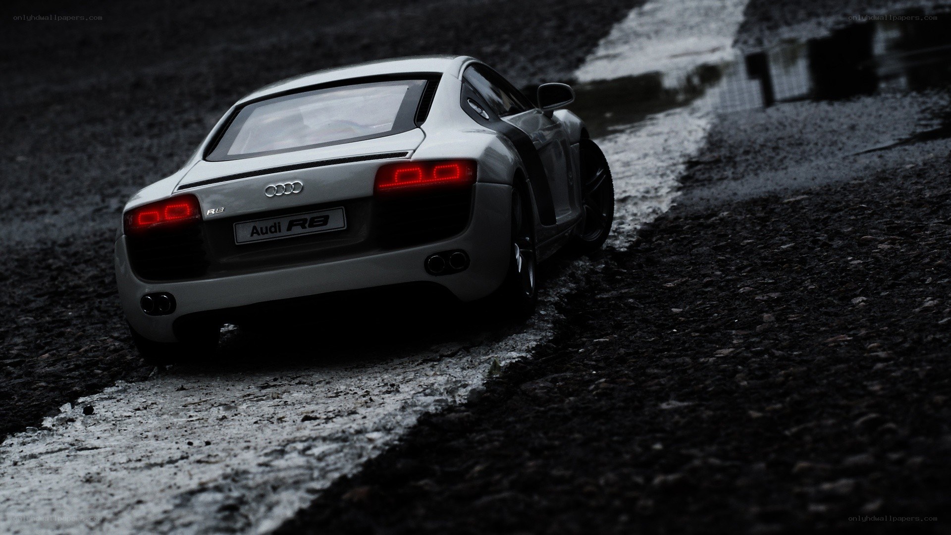 silver audi r8 on wet road