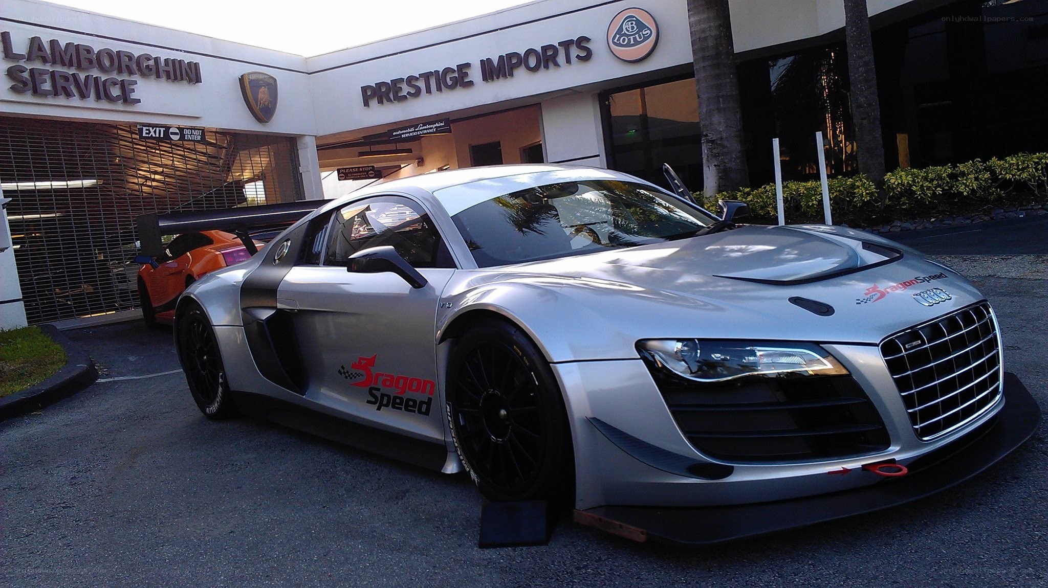 Silver Audi race car at dealership