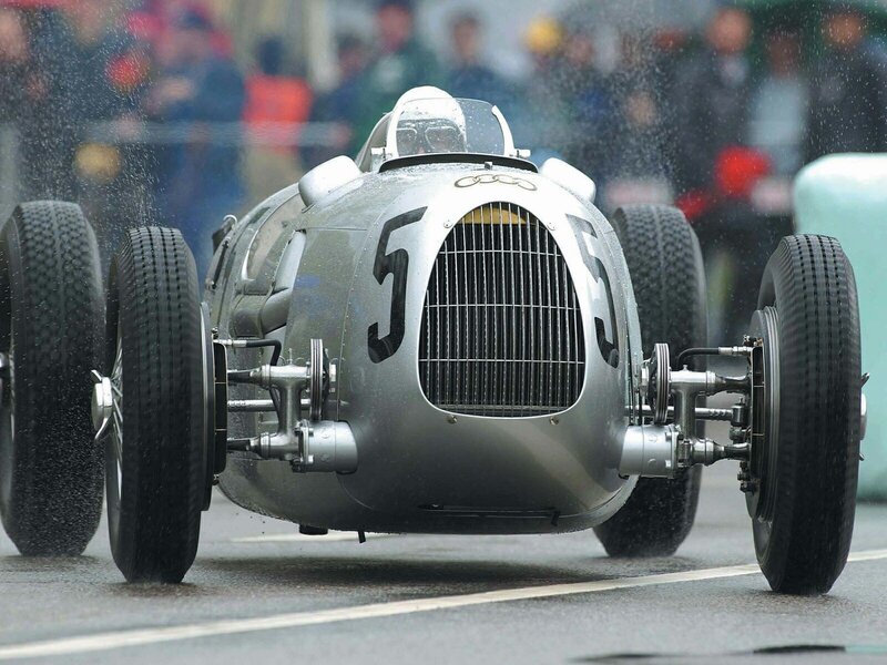 Silver Audi race car on wet track