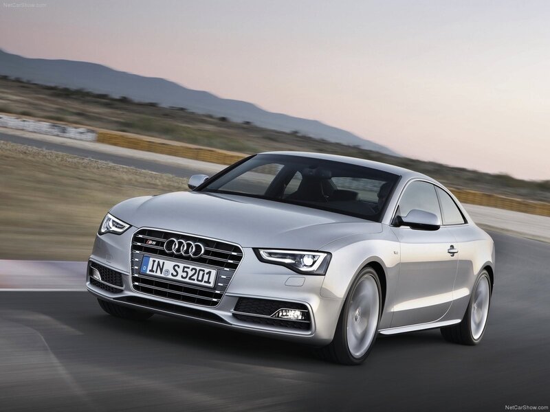 Silver Audi S5 Coupe in motion