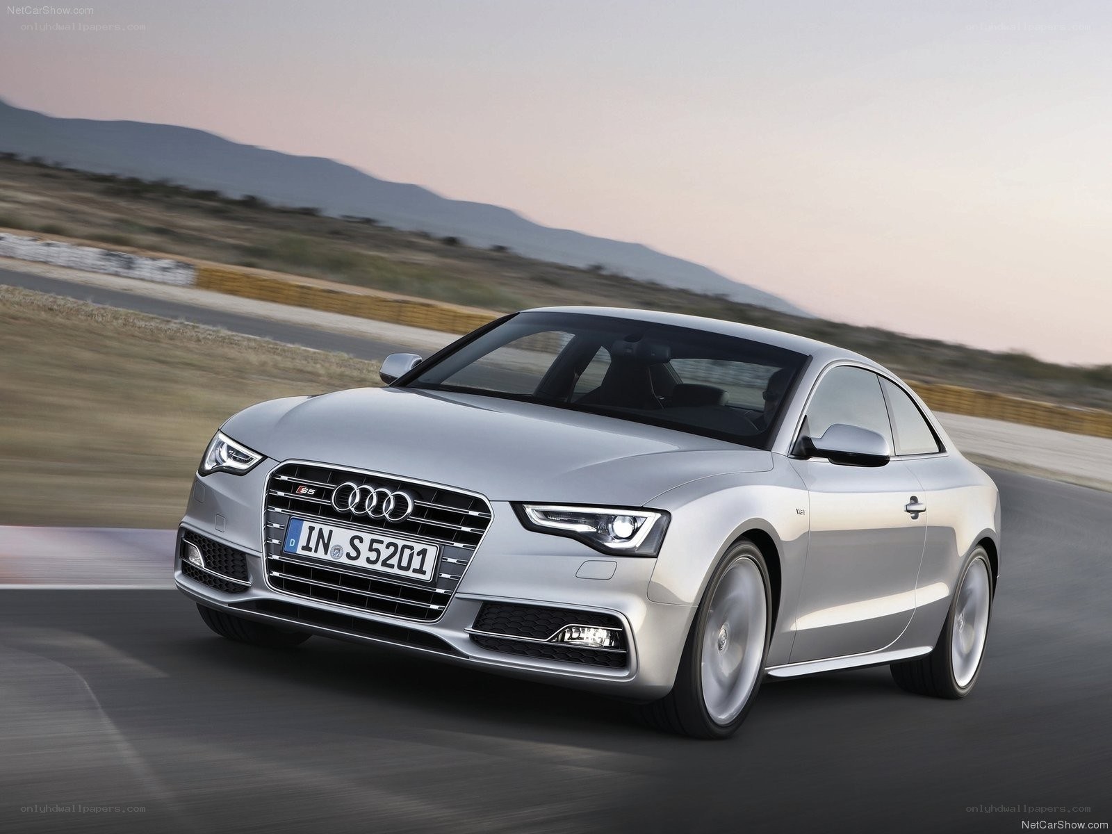 Silver Audi S5 Coupe in motion