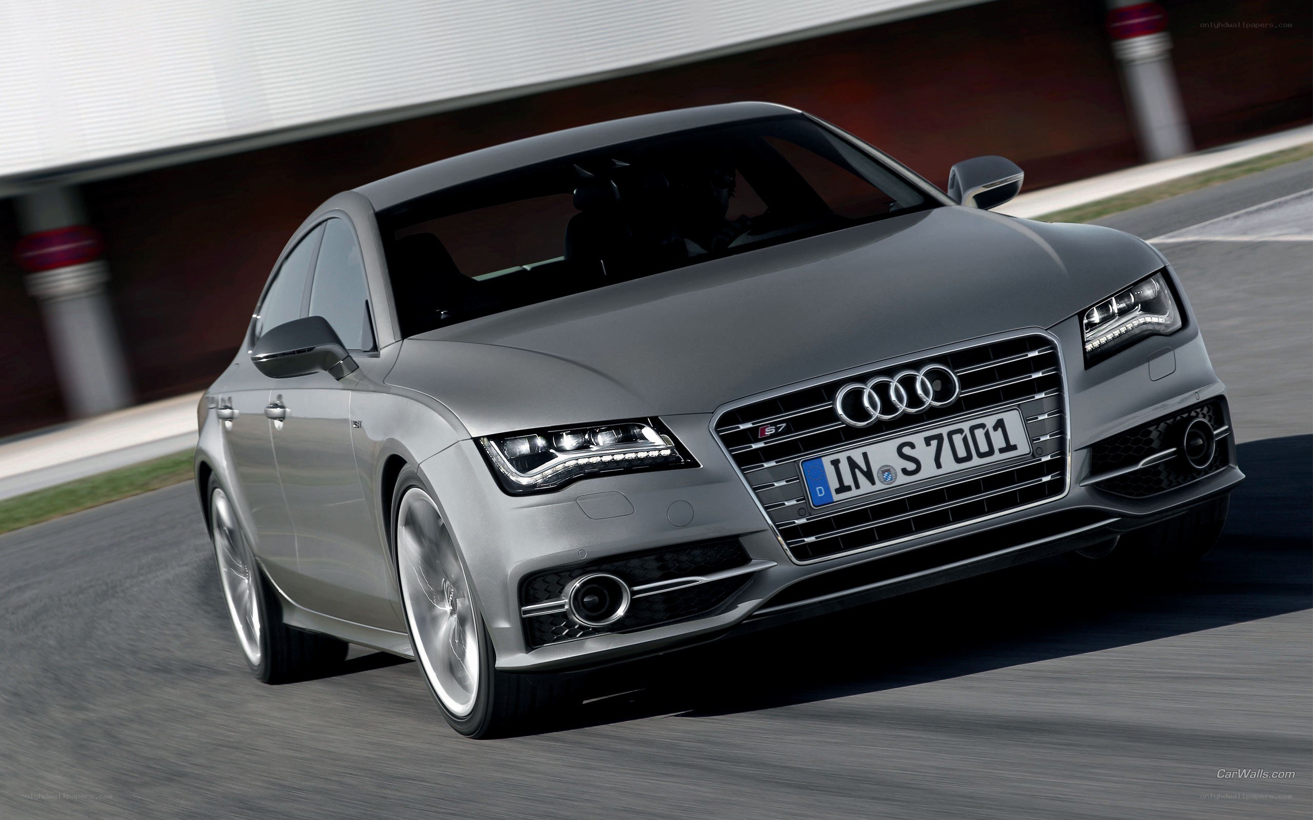 Silver Audi S7 on a racetrack