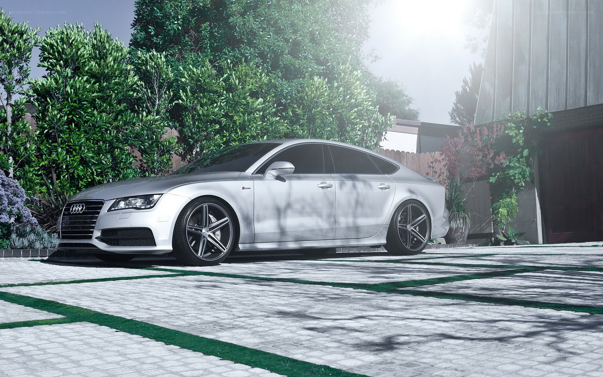 Silver Audi S7 parked in driveway