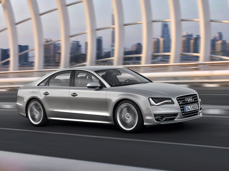 Silver Audi S8 driving on a bridge