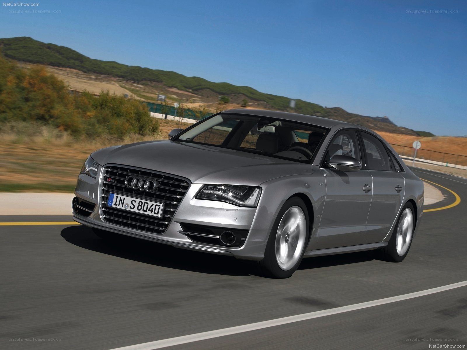 Silver Audi S8 driving on road