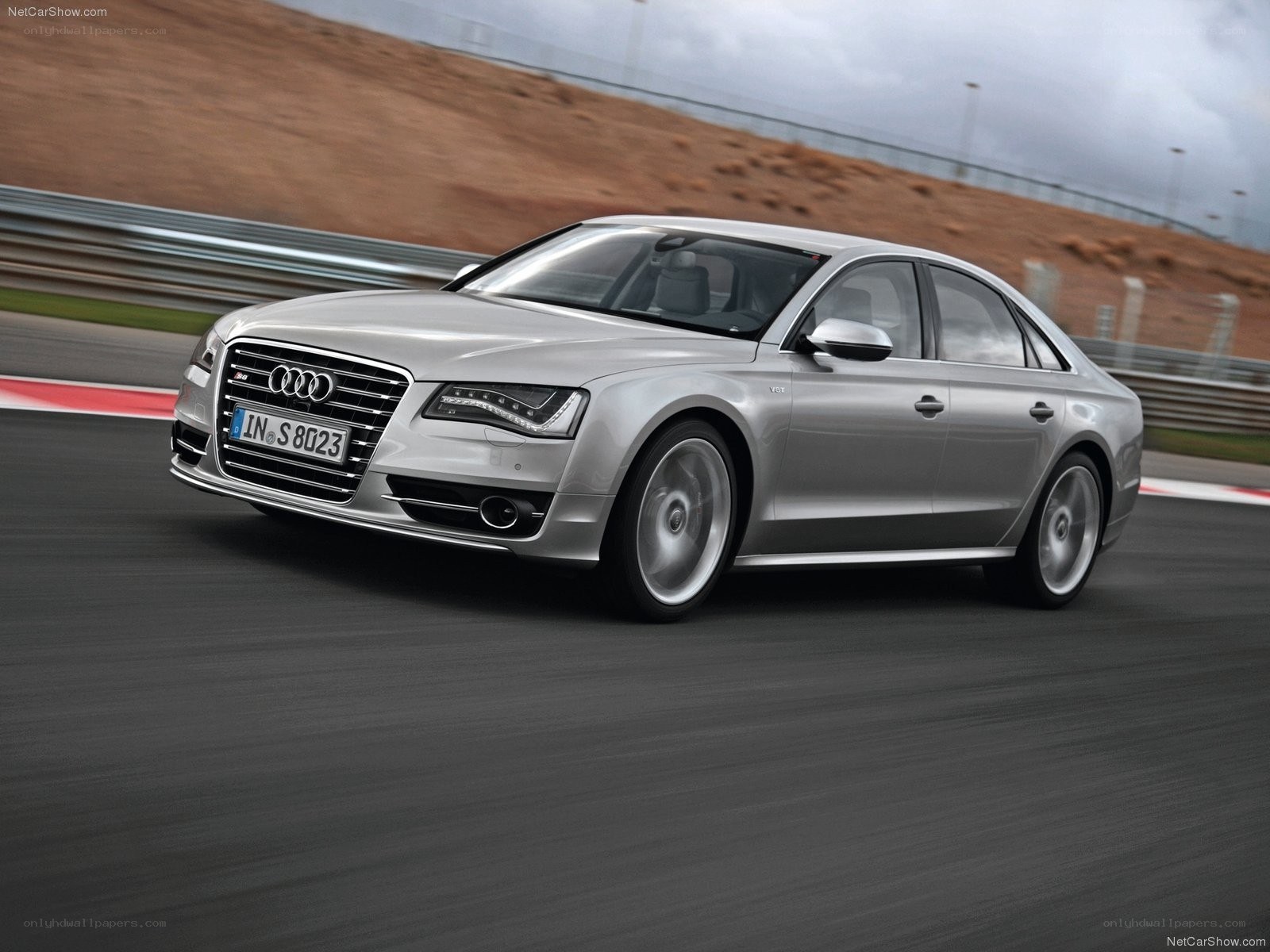 Silver Audi S8 on a racetrack